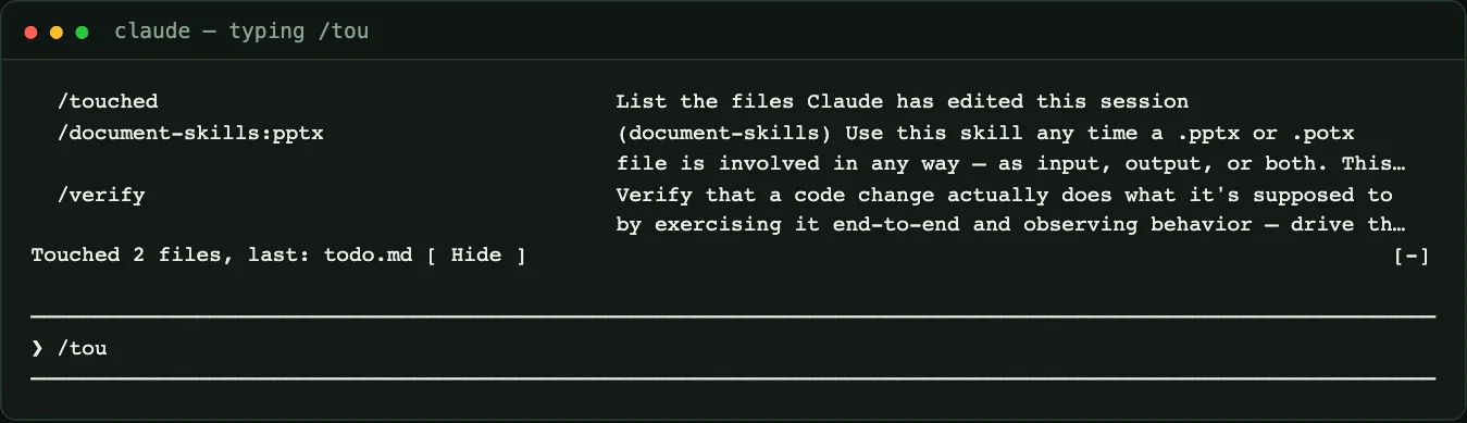 Claude Code slash command autocomplete showing /touched with the description List the files Claude has edited this session, above the Touched 2 files band
